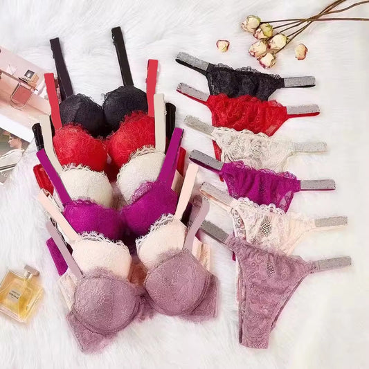Lace rhinestone bra underwear suit in various colors including black, red, pink, rose, and light purple arranged on a white background.
