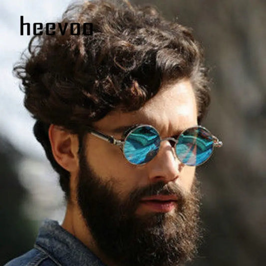 Men and Women Fashion Round Sun Glasses with blue lenses and metal frames, worn by a person outdoors.
